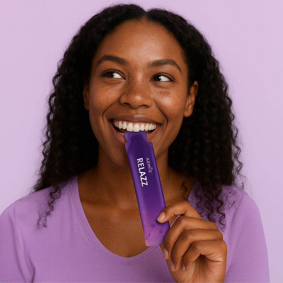 Woman sipping a RELAZZ sachet